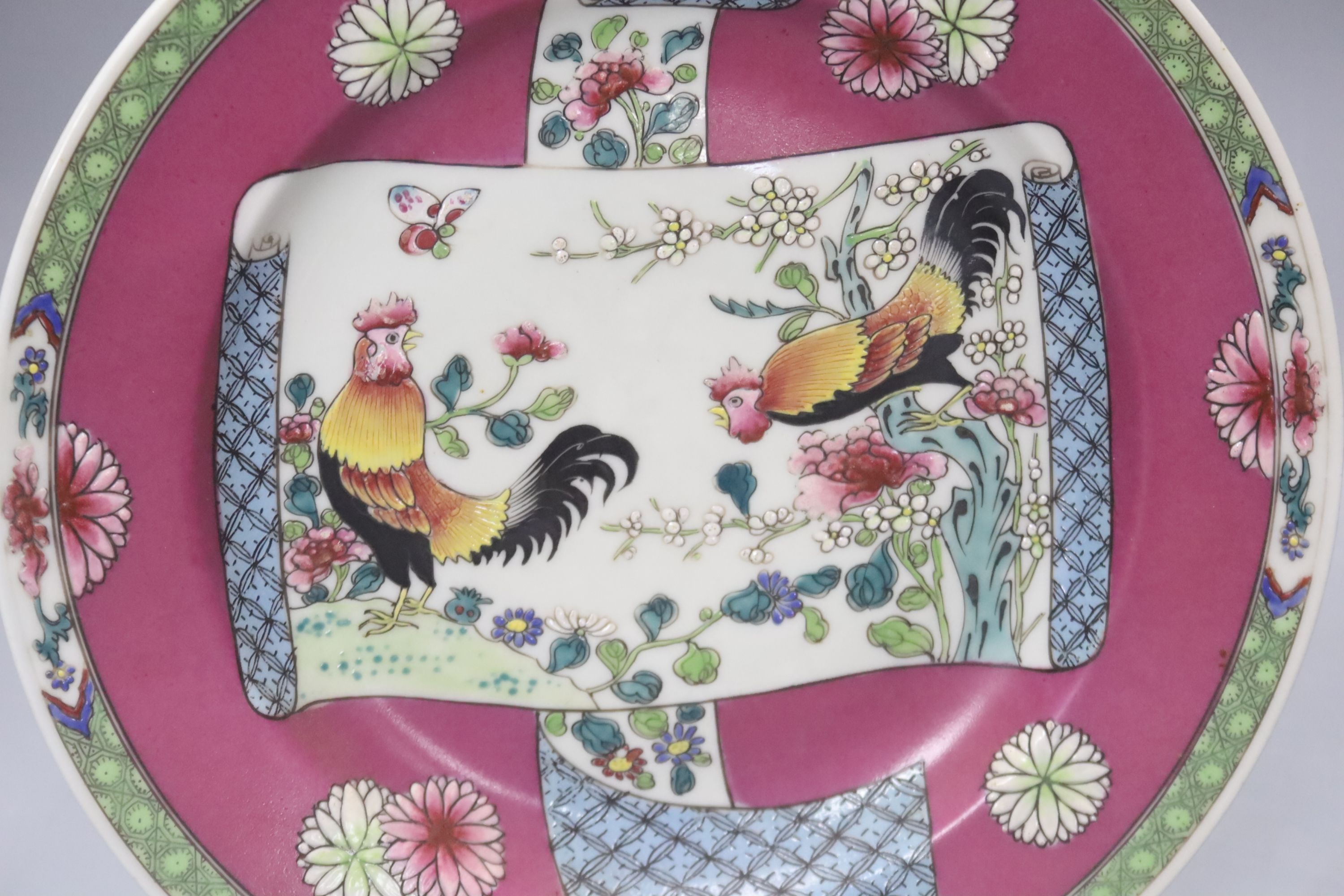 A pair of Chinese famille rose cockerel plates, diameter 24cm